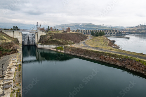The Dalles Lock and Dam built by the U.S.  Army Corps of Engineers in the Columbia River Gorge between Lyle, WA and The Dalles, Oregon, USA. photo