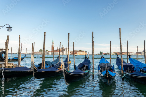 Grand canal with gondolas in travel Europe Venice city, Italy. Old italian architecture with landmark bridge, romantic boat. Venezia. © Maksym