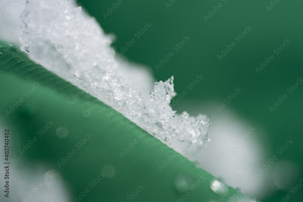 Fotografie Textile textures with water drops and snow macro abstract