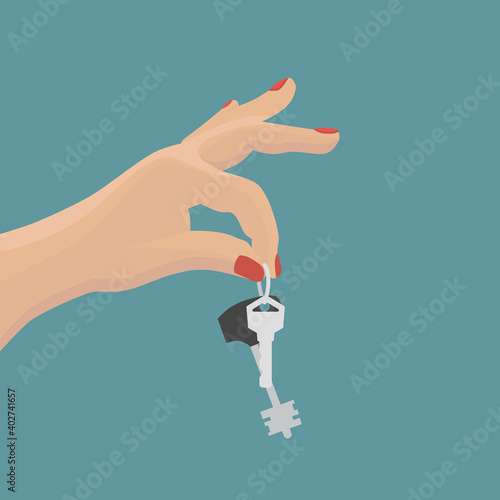 Keys are held by a female hand on a blue background.
