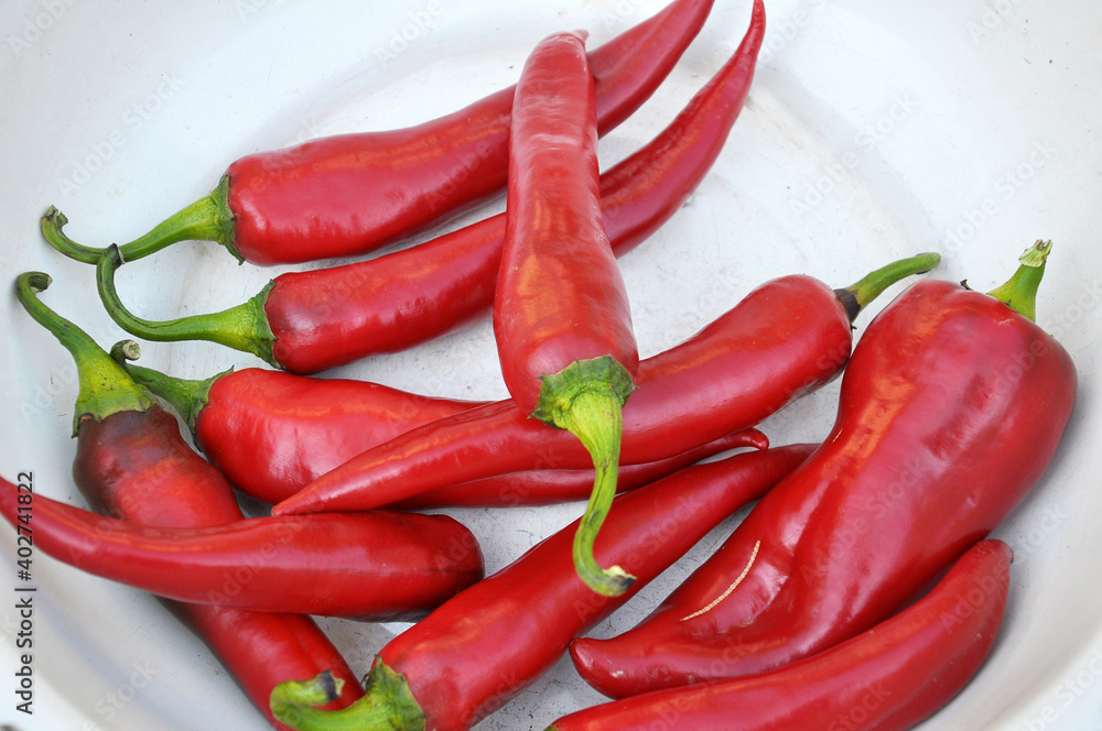 Red chili pepper lies in a bowl