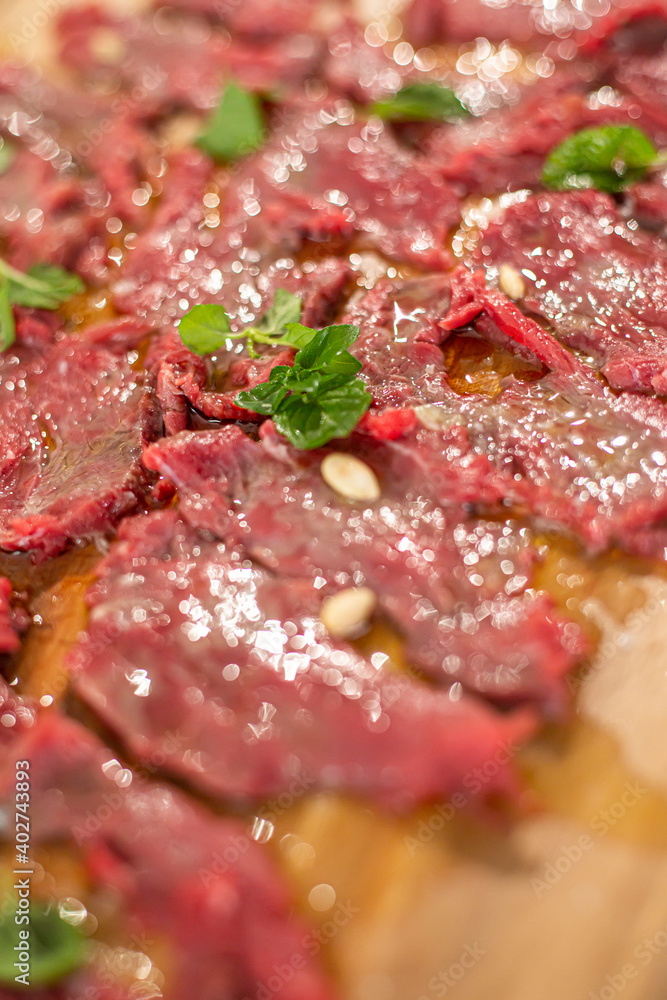 A close-up view of the ready-made carpaccio meat for tasting A close-up view of the ready-made carpaccio meat for tasting