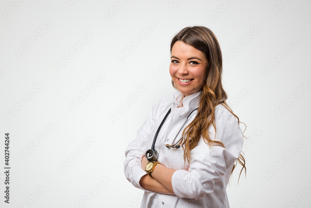 Young female doctor with stethoscope on white background. Portrait of smiling medicine student Young female doctor with stethoscope on white background. Portrait of smiling medicine student