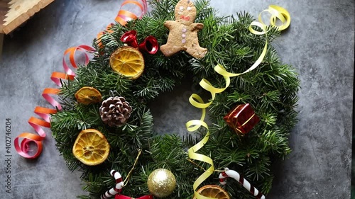 Women Making Christmas Wreath. New Year Holidaydecoration photo