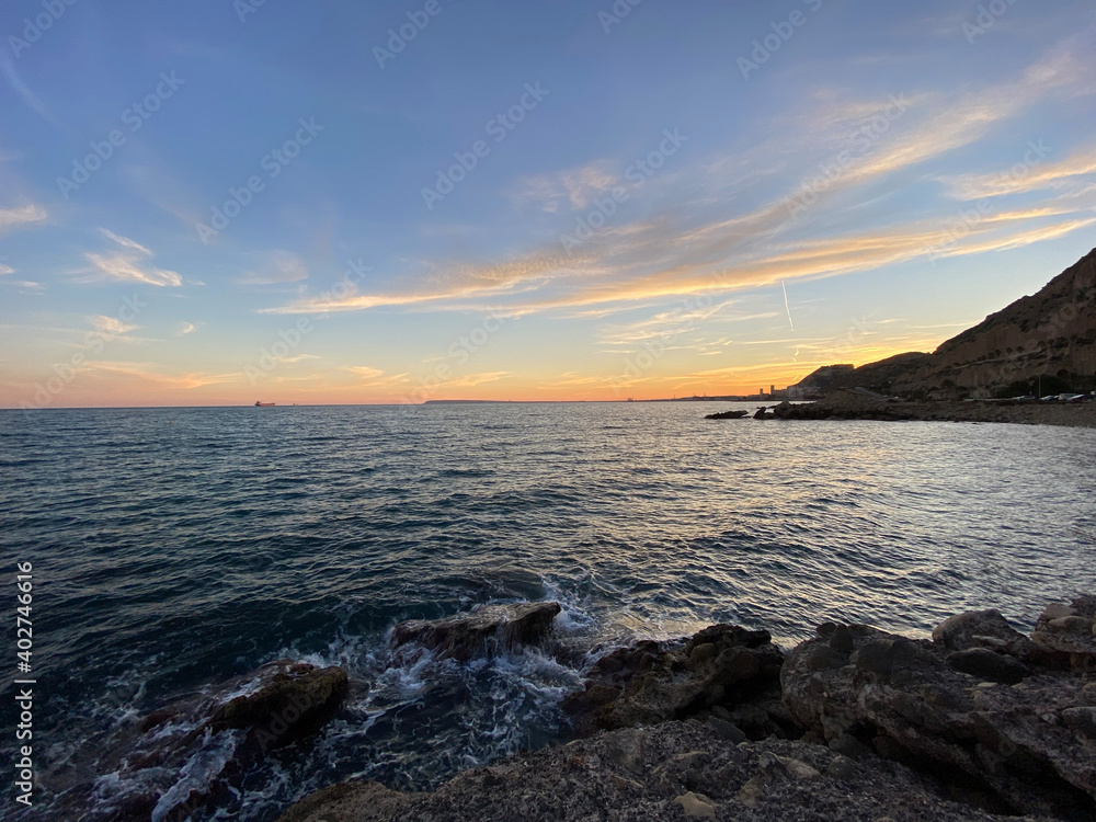 Beautiful and colorful sunset with cloud in the beach