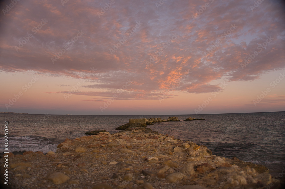 Beautiful and colorful sunset with cloud in the beach Beautiful and colorful sunset with cloud in the beach