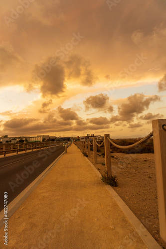 Beautiful and colorful sunset with cloud in the road © Javier Ocampo Bernas
