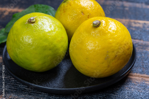 Fresh ripe bergamot orange fruits  fragrant citrus used in earl grey tea  medicine and spa treatments