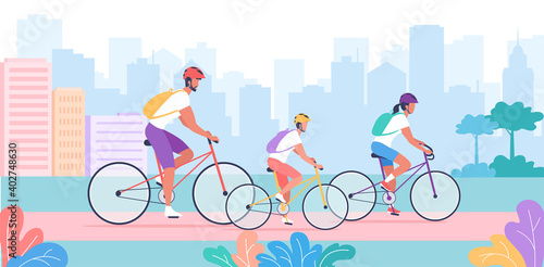 The sporty young family rides bicycles in the city park