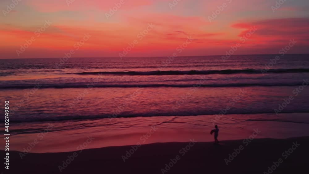 Flight at sunset overlooking the Indian Ocean in Bali Indonesia.