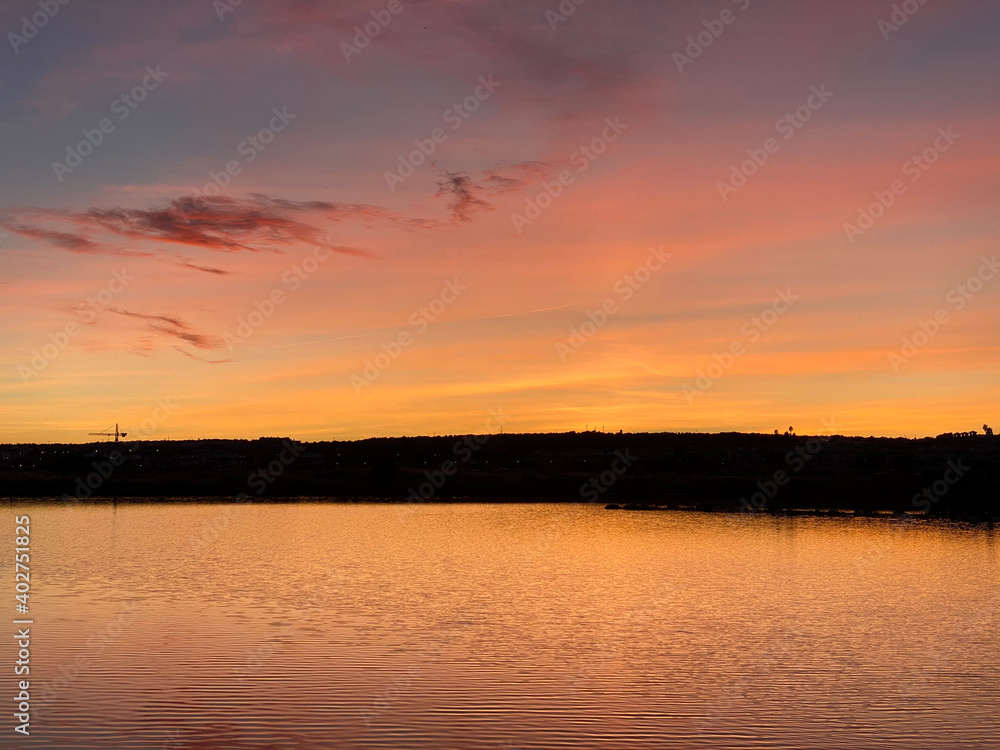 Beautiful and colorful sunset with cloud in the beach