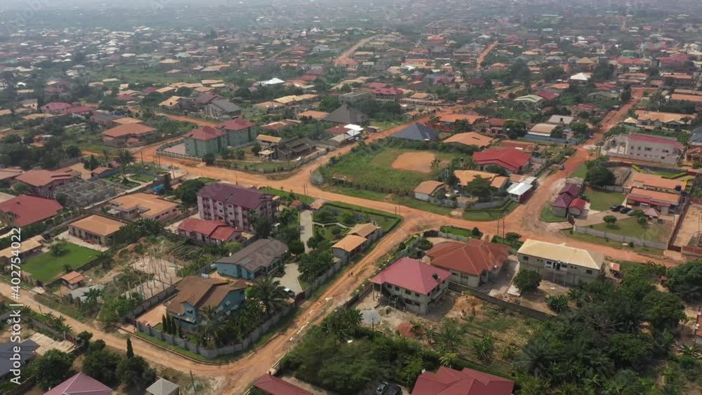 Aerial residential city center Kumasi Ghana Africa. Roads, streets poorly maintained rough dirt. Historical Ashanti Empire. Third world poor poverty area. Second largest town in Ghana. Economic. Aerial residential city center Kumasi Ghana Africa. Roads, streets poorly maintained rough dirt. Historical Ashanti Empire. Third world poor poverty area. Second largest town in Ghana. Economic.