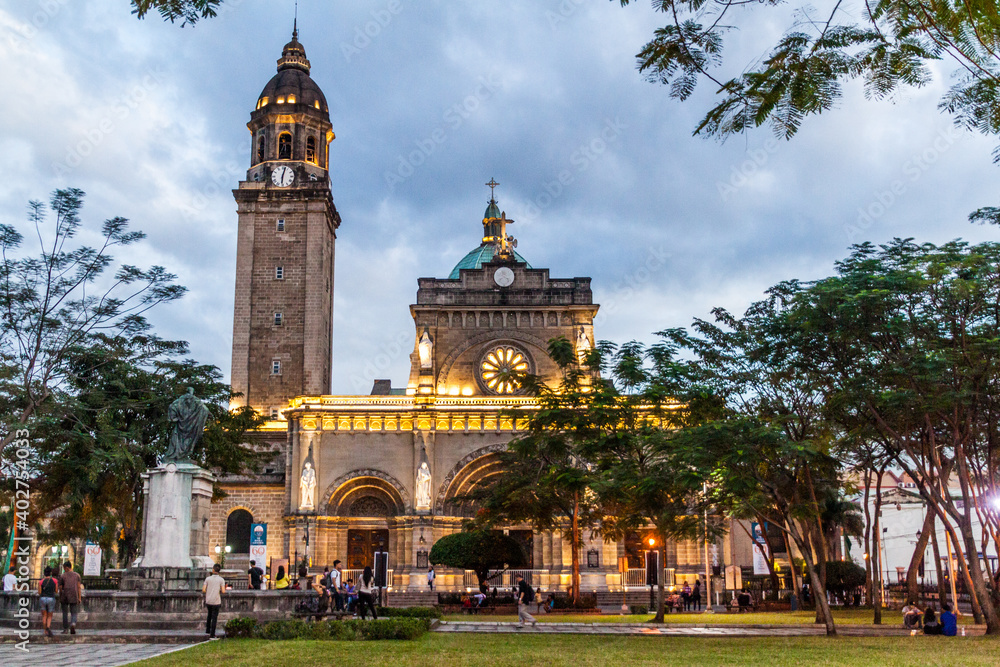 MANILA, PHILIPPINES - JANUARY 27, 2018: Evenig view of theThe Minor Basilica and Metropolitan Cathedral of the Immaculate Conception (Manila Cathedral) in Manila.