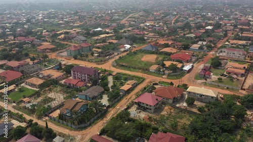 Aerial residential city center Kumasi Ghana Africa. Roads, streets poorly maintained rough dirt. Historical Ashanti Empire. Third world poor poverty area. Second largest town in Ghana. Economic. photo