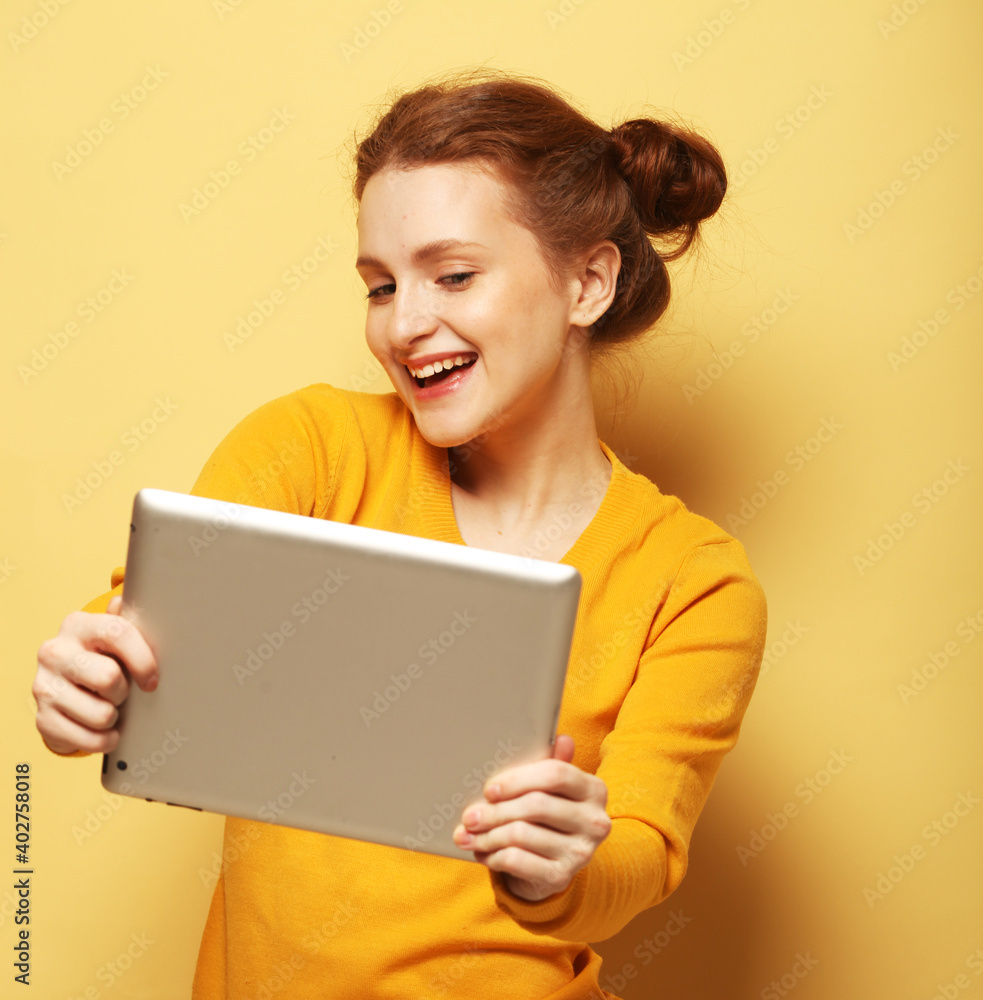 lifestyle, tehnology and people concept: Happy redhair female taking selfie with digital tablet lifestyle, tehnology and people concept: Happy redhair female taking selfie with digital tablet