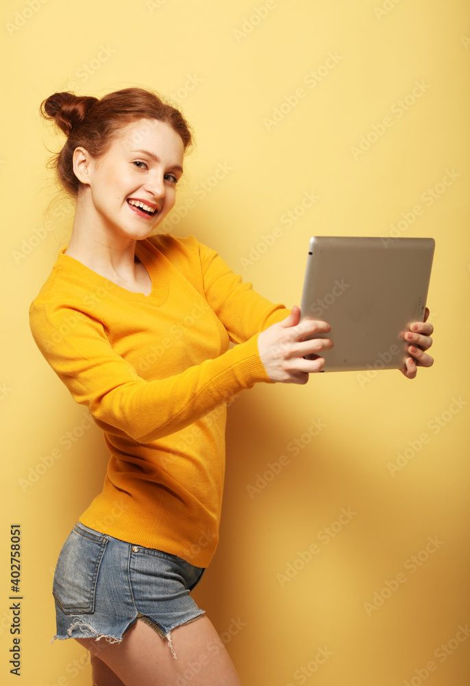 lifestyle, tehnology and people concept: Happy redhair female taking selfie with digital tablet lifestyle, tehnology and people concept: Happy redhair female taking selfie with digital tablet