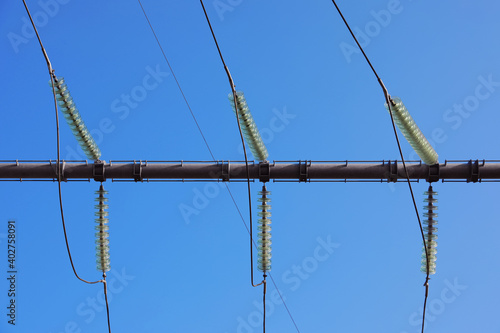 Wallpaper Mural Electricity transmission power lines against blue sky, low angle view Torontodigital.ca