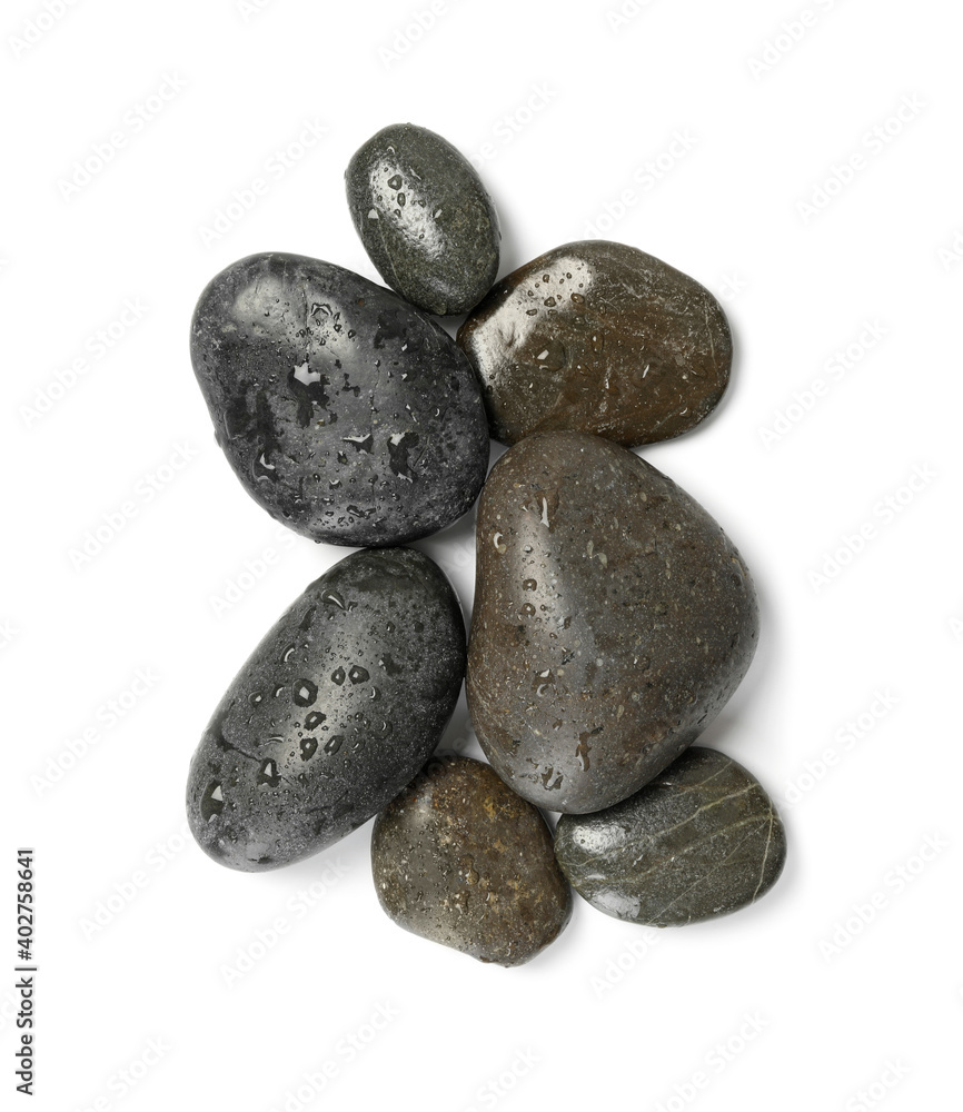 Wet spa stones on white background, top view Wet spa stones on white background, top view