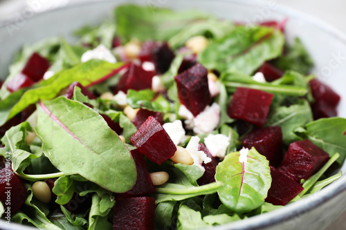 Delicious beet salad in bowl, closeup view