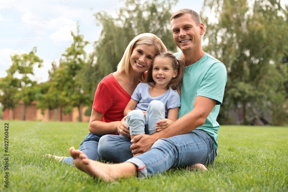 Happy family spending time together in park on sunny summer day Happy family spending time together in park on sunny summer day