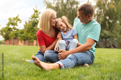 Happy family spending time together in park on sunny summer day