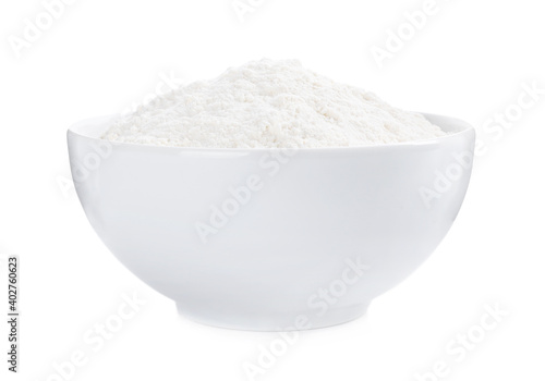 Organic flour in ceramic bowl isolated on white.