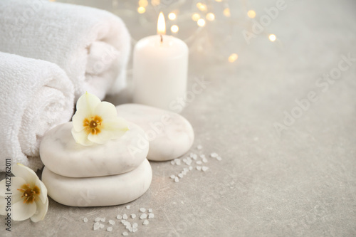 Spa composition with towels on light background  space for text
