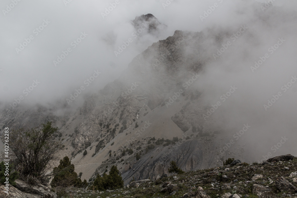 Rocks in mist in Fann mountains, Tajikistan