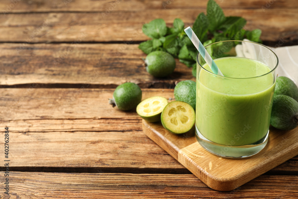 Fresh feijoa smoothie and fresh fruits on wooden table. Space for text Fresh feijoa smoothie and fresh fruits on wooden table. Space for text