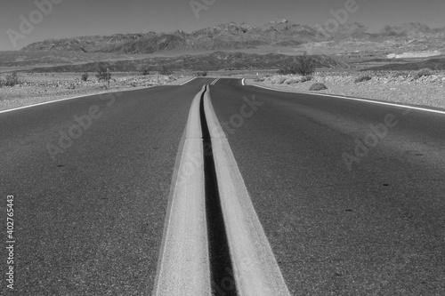 Highway to the mountains in Death Valley