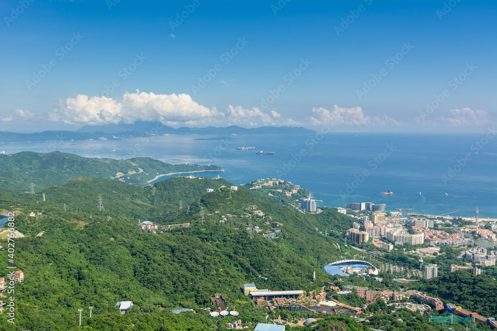 Beautiful coastline and villas in Shenzhen Bay  against cloudy sky , View from Overseas Chinese Town East  (OCT East ) in Shenzhen, Guangdong, China.