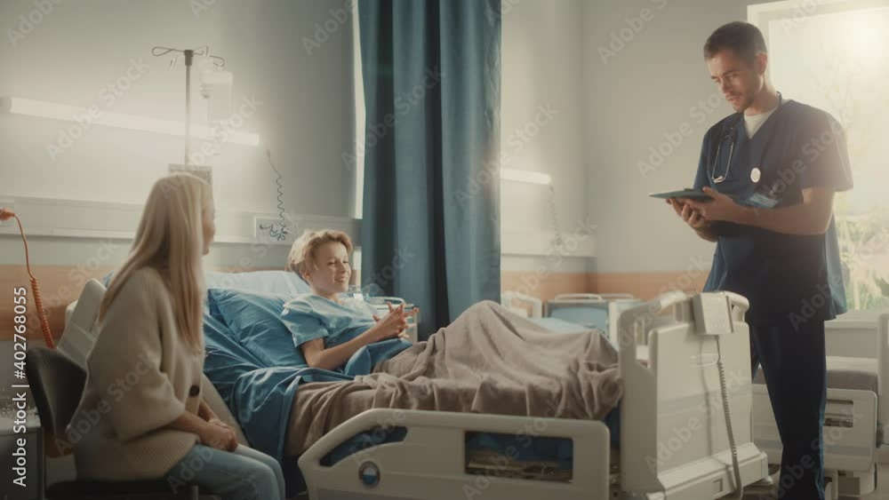 Hospital Ward: Handsome Young Boy Resting in Bed with Caring Mother Visits to Support Him, Friendly Doctor, Surgeon, Nurse Talks, Does High-Five with a Happy Smiling Patient Recovering after Sickness Hospital Ward: Handsome Young Boy Resting in Bed with Caring Mother Visits to Support Him, Friendly Doctor, Surgeon, Nurse Talks, Does High-Five with a Happy Smiling Patient Recovering after Sickness