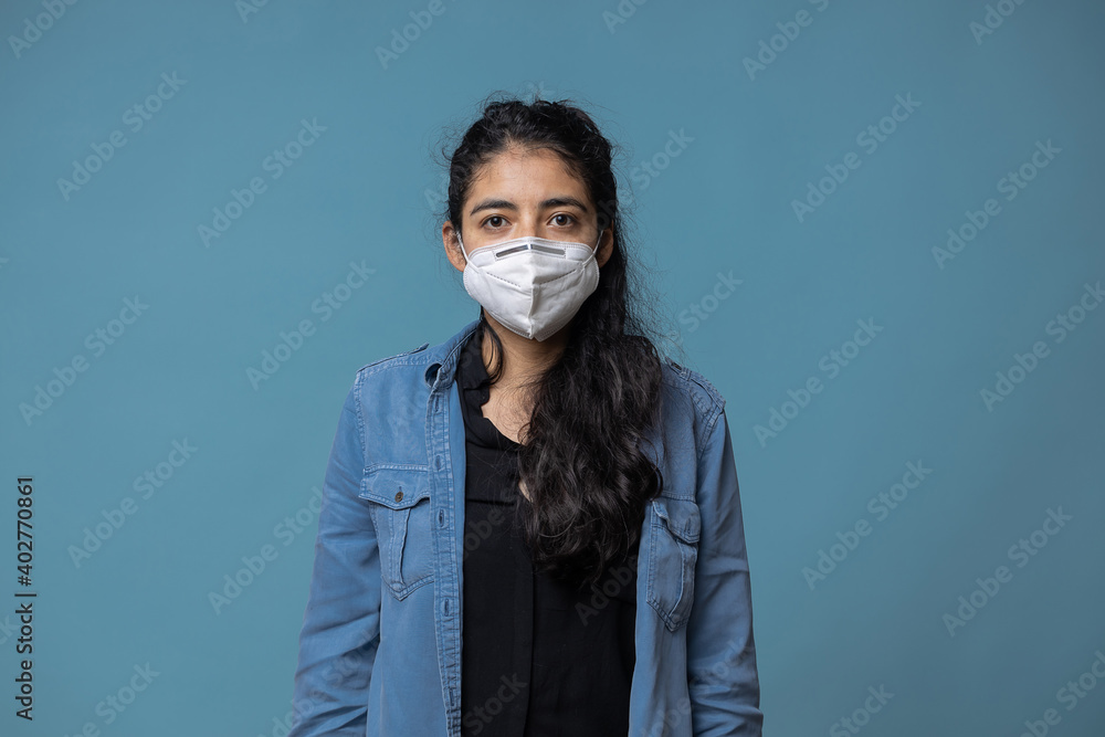 Mexican young woman wearing face mask isolated Mexican young woman wearing face mask isolated