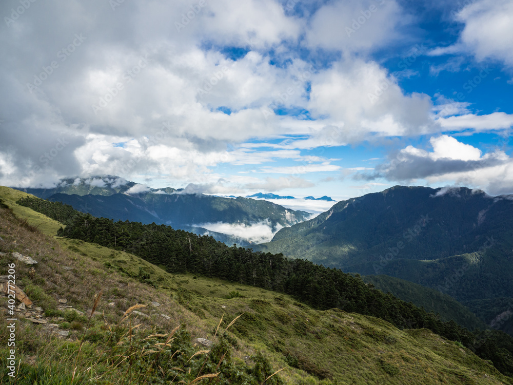 Naklejka premium Smoke and fog over the landscapes. beautiful mountains with blue sky, Mount Hehuan, Taiwan