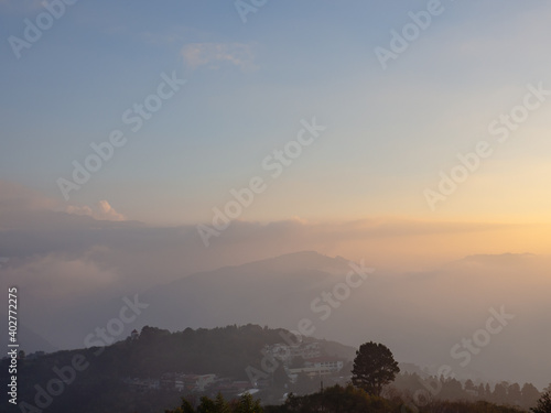 Beautiful misty mountain forest in sunset time