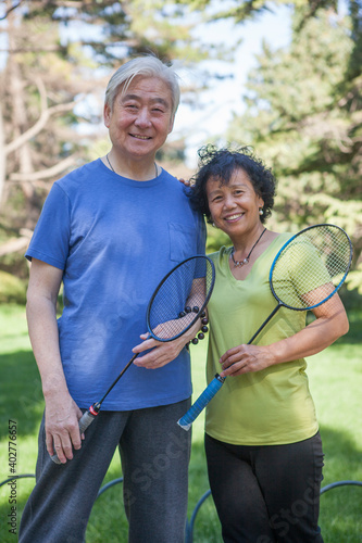 Two old people exercising in the park