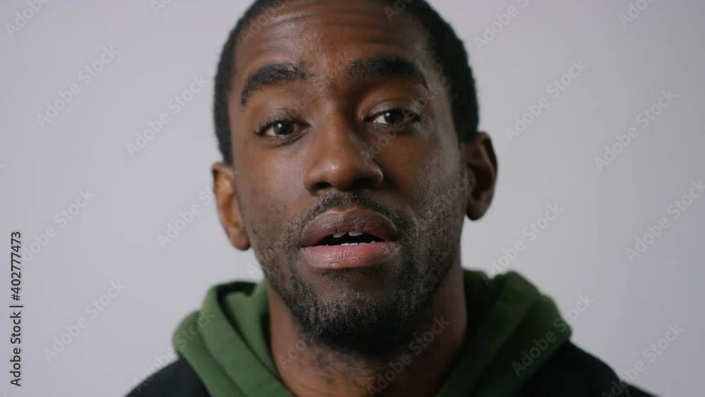 Portrait of cool, handsome black man talking straight to camera Portrait of cool, handsome black man talking straight to camera