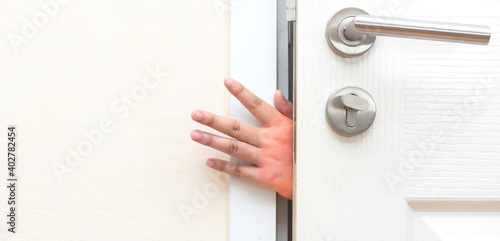 Pinching  hand at the door.Accident and safety precaution concept