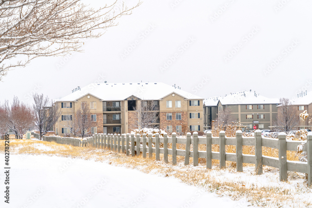 Facade of multi storey residential buildings on a snow covered town in winter