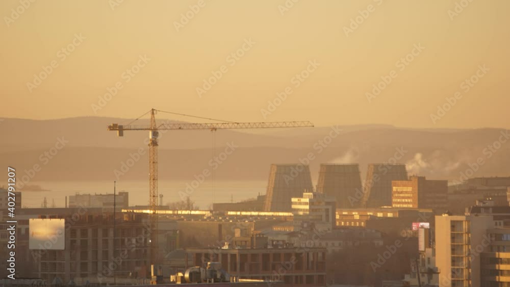construction of the house with a crane and lake construction of the house with a crane and lake
