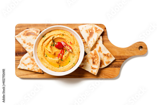 Fotografija Roasted red pepper hummus with pita bread isolated on white background