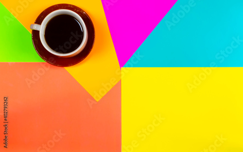 Cup of coffee on colorful background.With space for your text or creativity