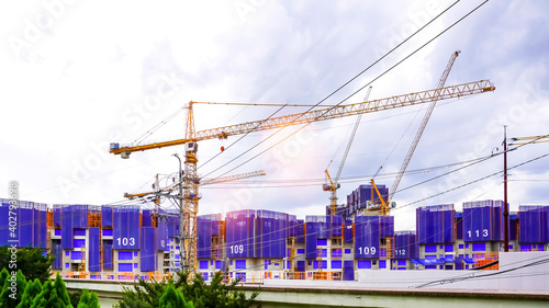 Photography Tower crane at a construction site building an apartment