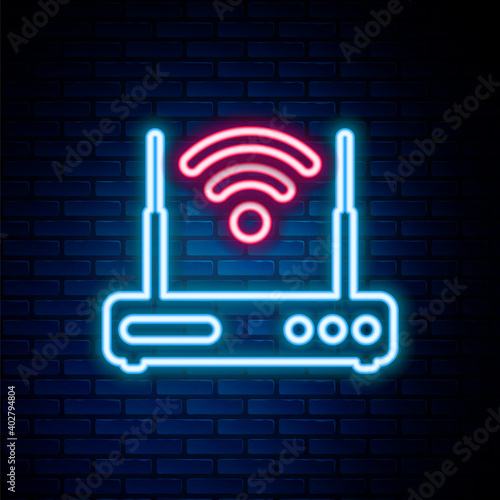 Glowing neon line Router and wi-fi signal symbol icon isolated on brick wall background. Wireless ethernet modem router. Computer technology internet. Colorful outline concept. Vector.