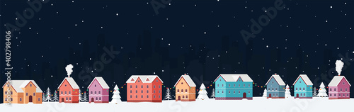 Winter cityscape at night with snow among snowdrifts and Christmas trees with festive garlands. Snowy panorama city eve New Year's holidays.