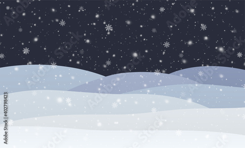 Winter snowfall with snowflakes at night. Cold winter landscape with snowdrifts Christmas and New Year background.