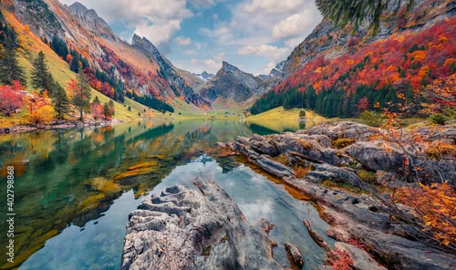 Obraz Landscape photography. Attractive morning view of Swiss Alps. Santis peak reflected in the calm surface of pure water of lake. Spectacular autumn scene of Seealpsee lake, Switzerland.