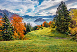 Beautiful autumn scenery. Attractive morning view of outskirts of  Stansstad town, Switzerland, Europe. Exciting autumn scene of  Lucerne lake, Swiss Alps. Landscape photography..