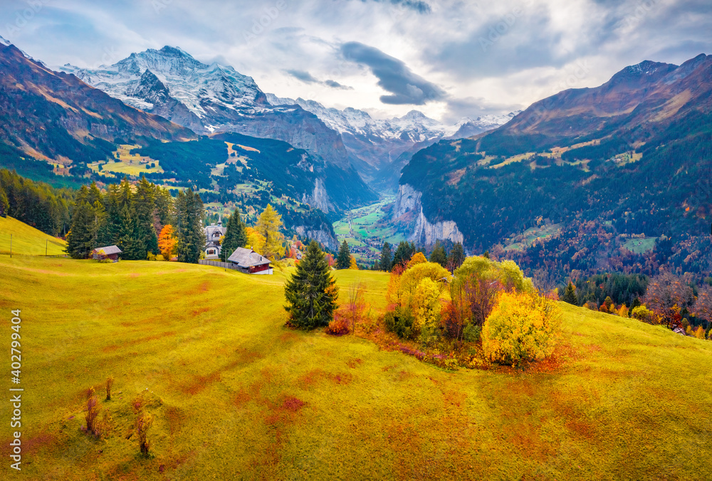 Obraz premium View from fAerial landscape photography. Colorful summer view from flying drone of Wengen village, district of Lauterbrunnen. Gloomy morning scene of Swiss Alps, Switzerland, Europe.