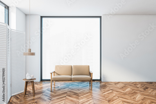 White and wooden hall with sofa and small table, white screen near window